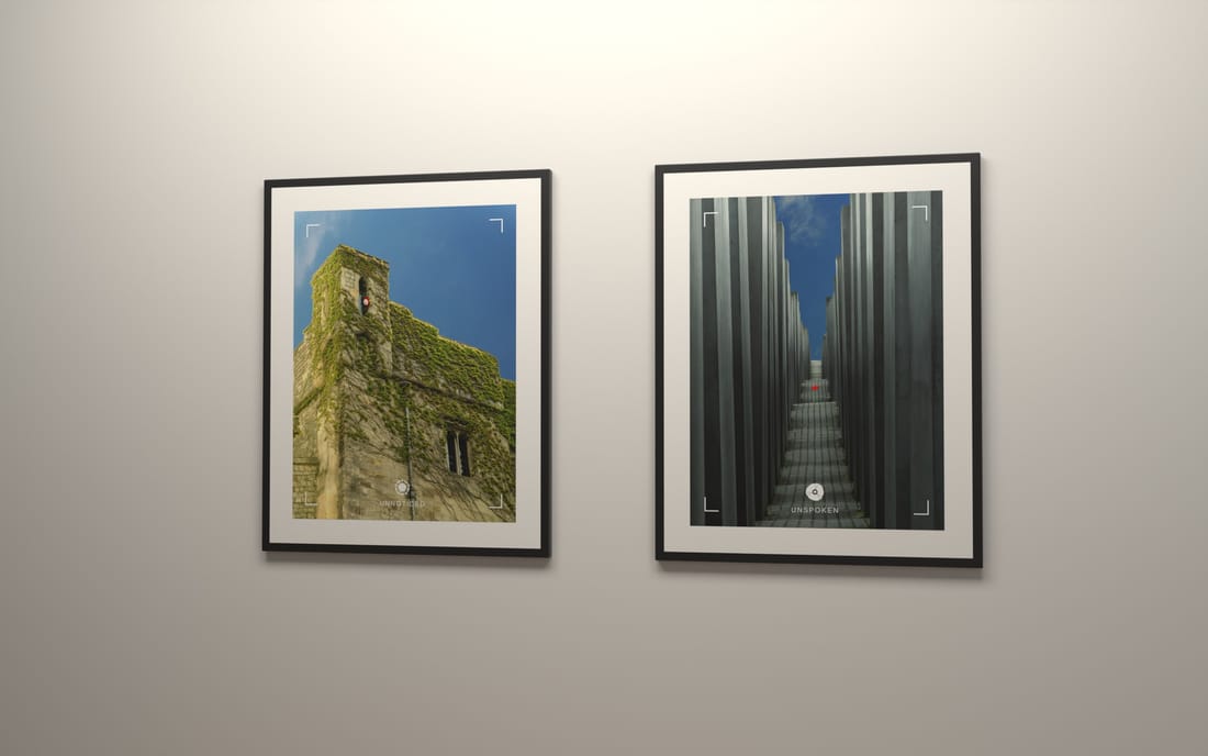 Two framed photographic prints on a pale wall: an ivy-covered stone tower and a narrow aisle between tall concrete stelae.