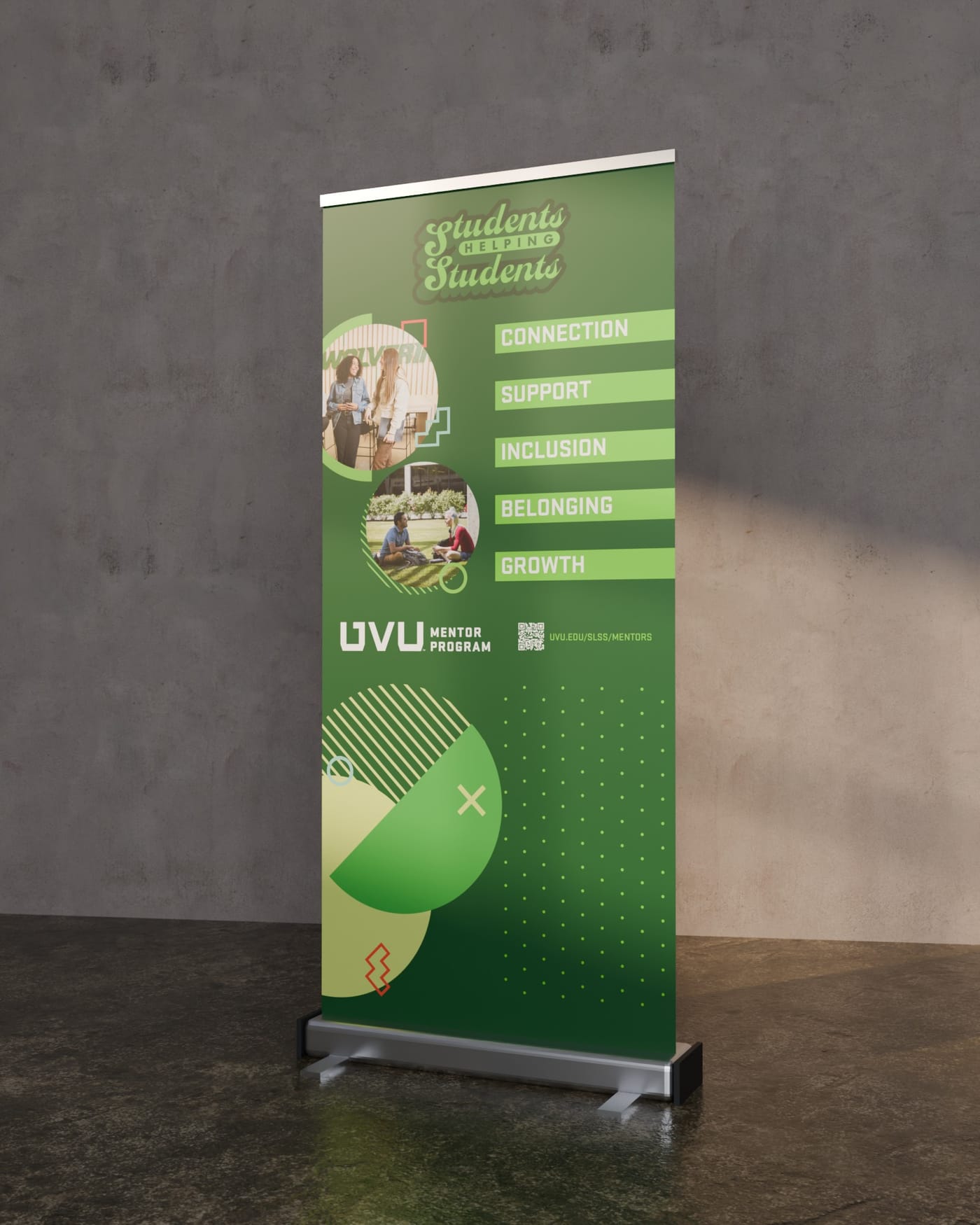 A green Students Helping Students pull-up banner listing Connection, Support, Inclusion, Belonging and Growth, with student photos in circles, standing against a plaster wall.
