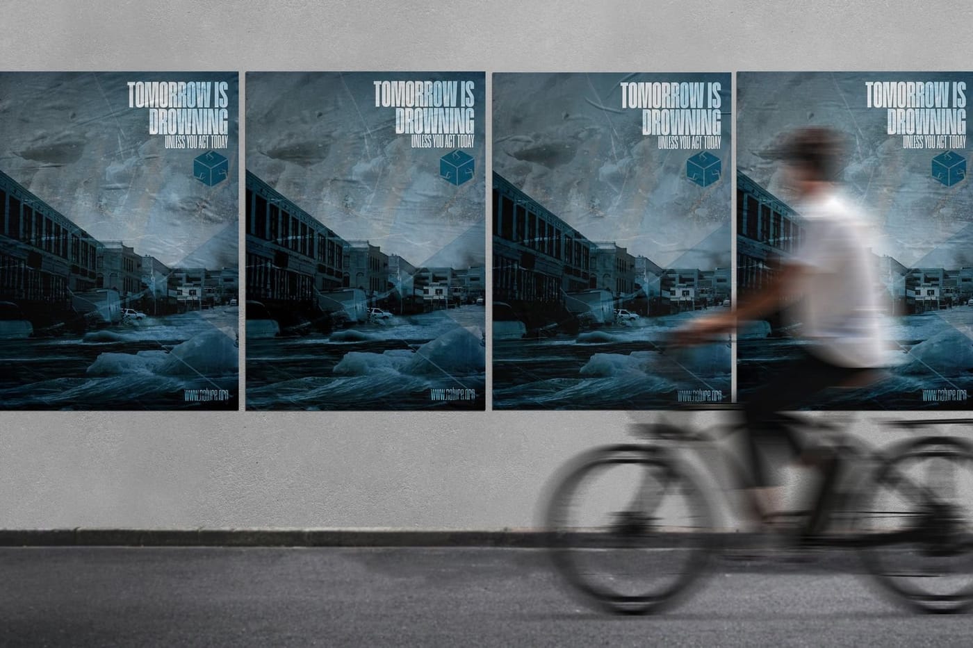The three posters pasted on a wall as a cyclist passes.